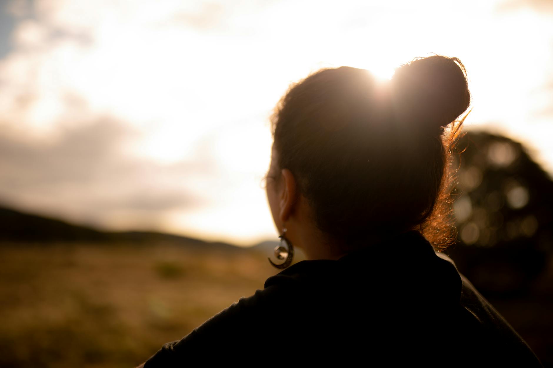 selective focus photography of back of a woman wearing black top